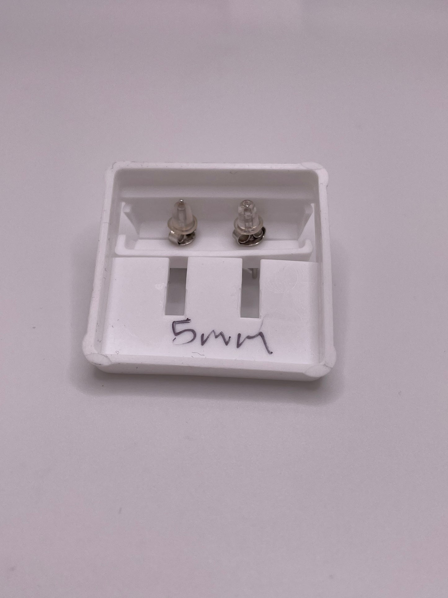 Sterling silver princess-cut CZ stud earrings in 5mm and 6mm, with butterfly backs, sold individually or as a set.