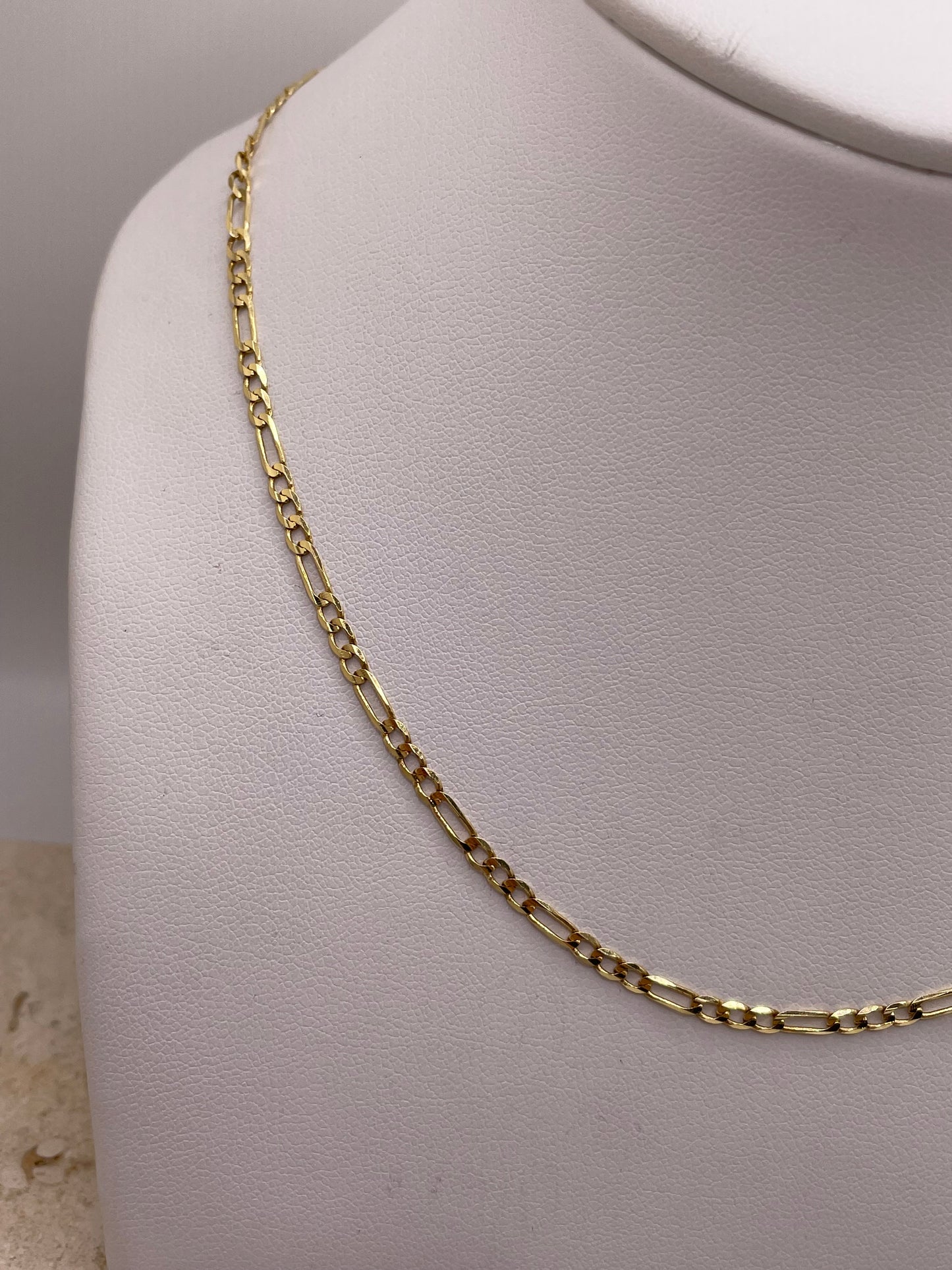 14k gold figaro chain enero