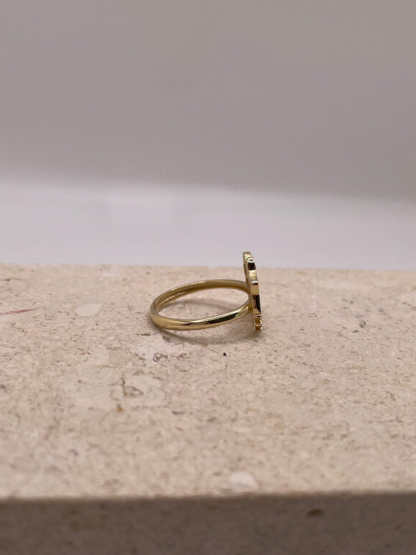 Side view of 14K gold Hello Kitty ring showcasing the band and CZ details