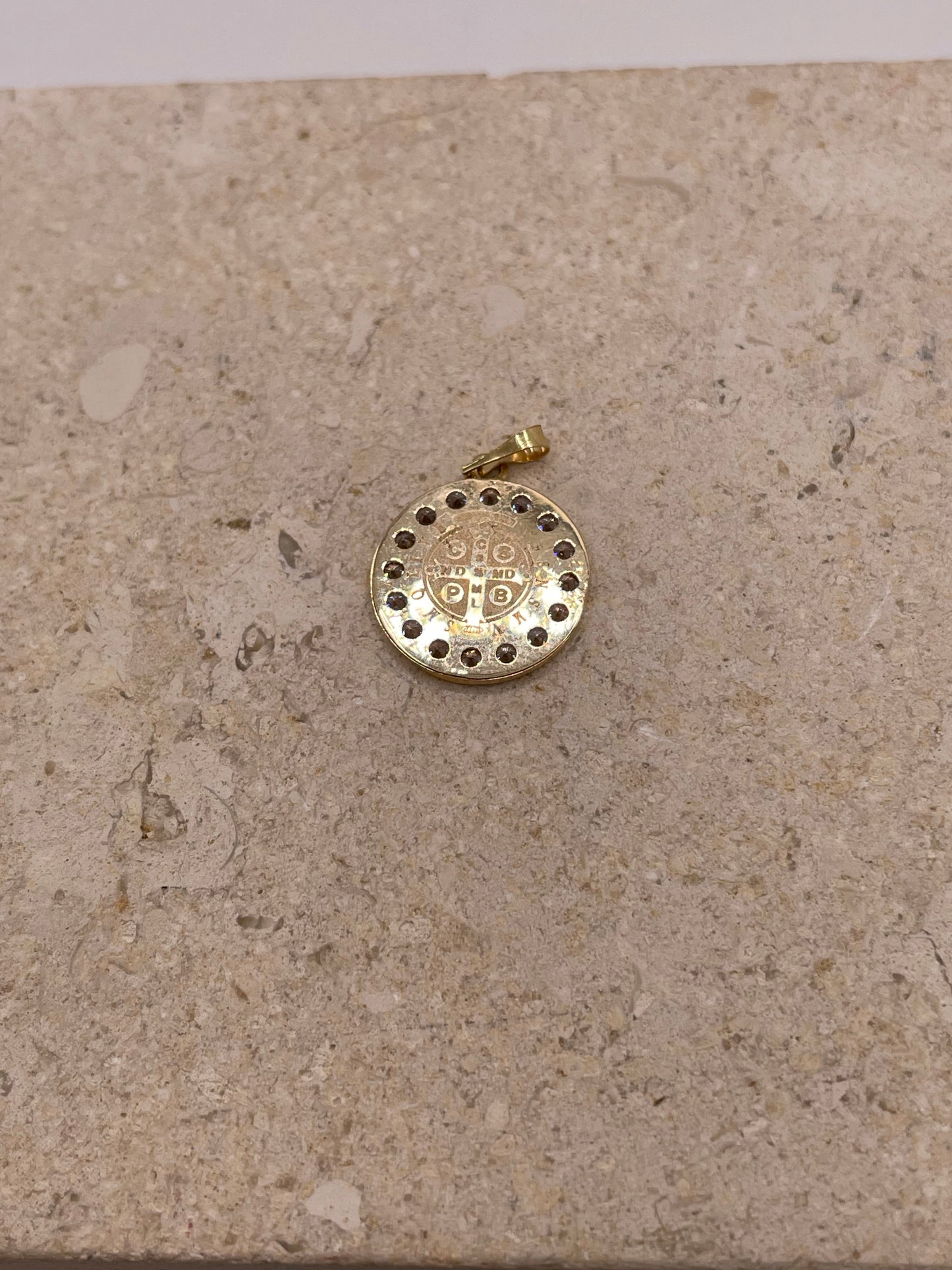 A back view showing the smooth, polished surface of the pendant and the bail, highlighting the high-quality 14k gold craftsmanship