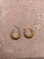 14K yellow gold 13mm fancy hollow hoop earrings with engraved details, lightweight design for toddlers or women.