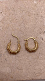 14K yellow gold 13mm fancy hollow hoop earrings with engraved details, lightweight design for toddlers or women.