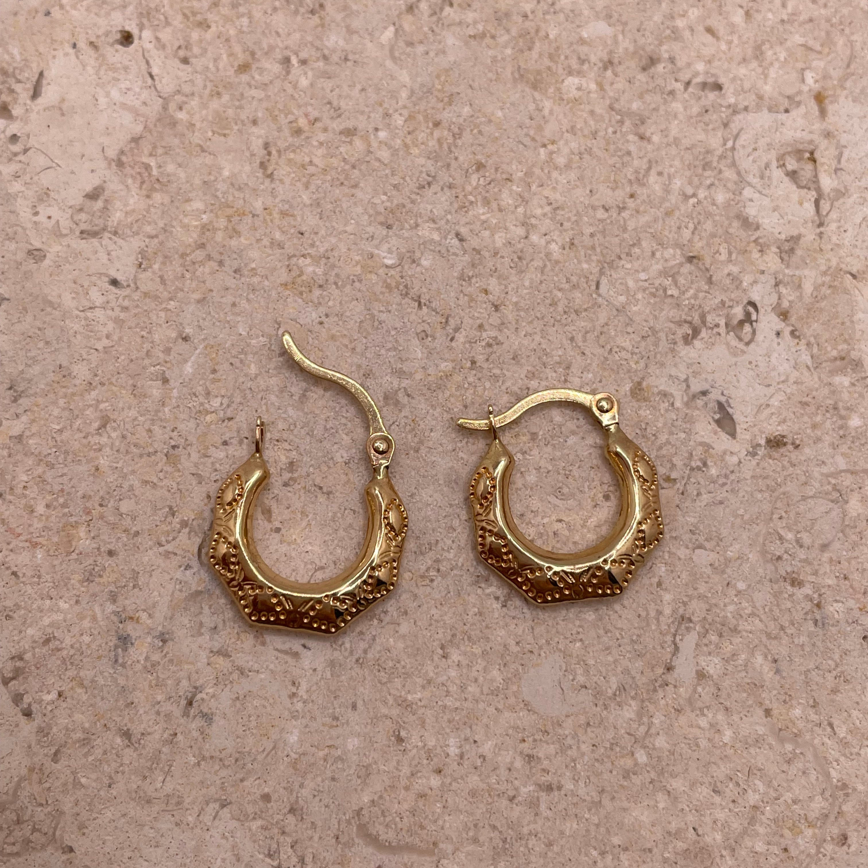 14K yellow gold 13mm fancy hollow hoop earrings with engraved details, lightweight design for toddlers or women.