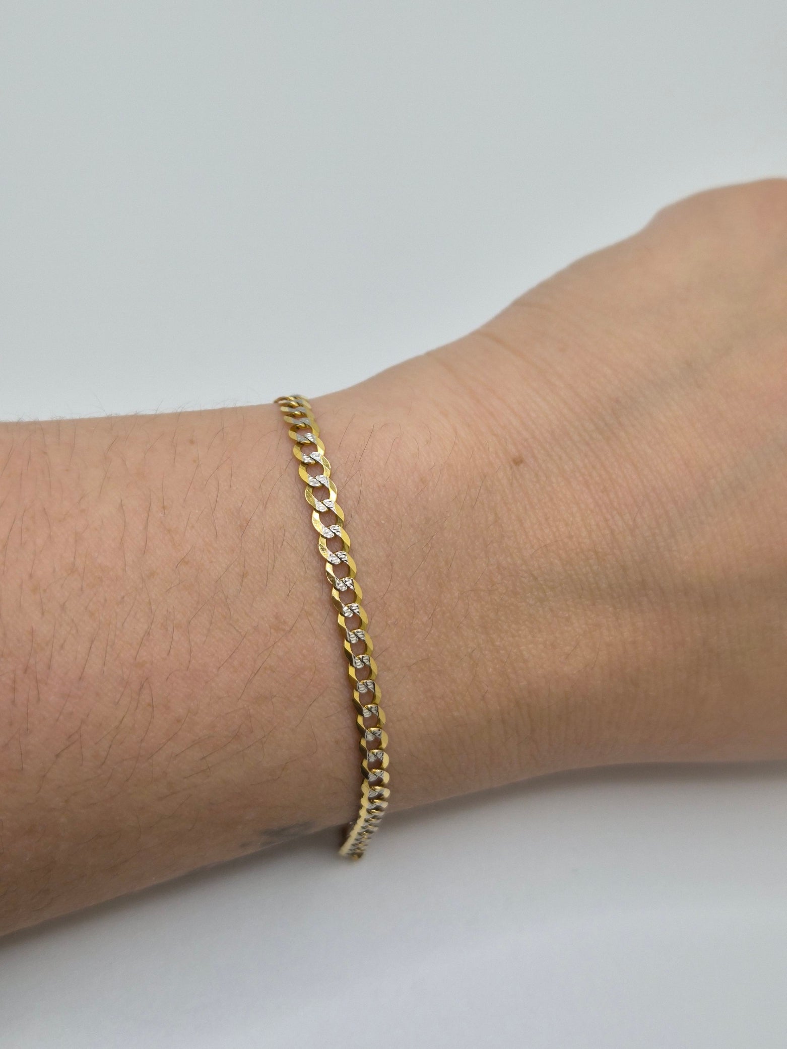 14K two-tone 3.6mm Cuban link bracelet with white gold diamond-cut details