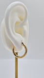 14K yellow gold diamond-cut mini hoop earrings, 20mm round lightweight design with textured shine.