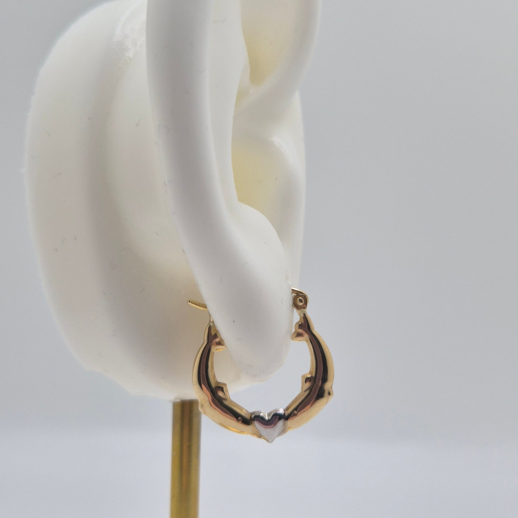 14K two-tone gold dolphin hoop earrings forming a heart design, 17mm lightweight hollow hoops.
