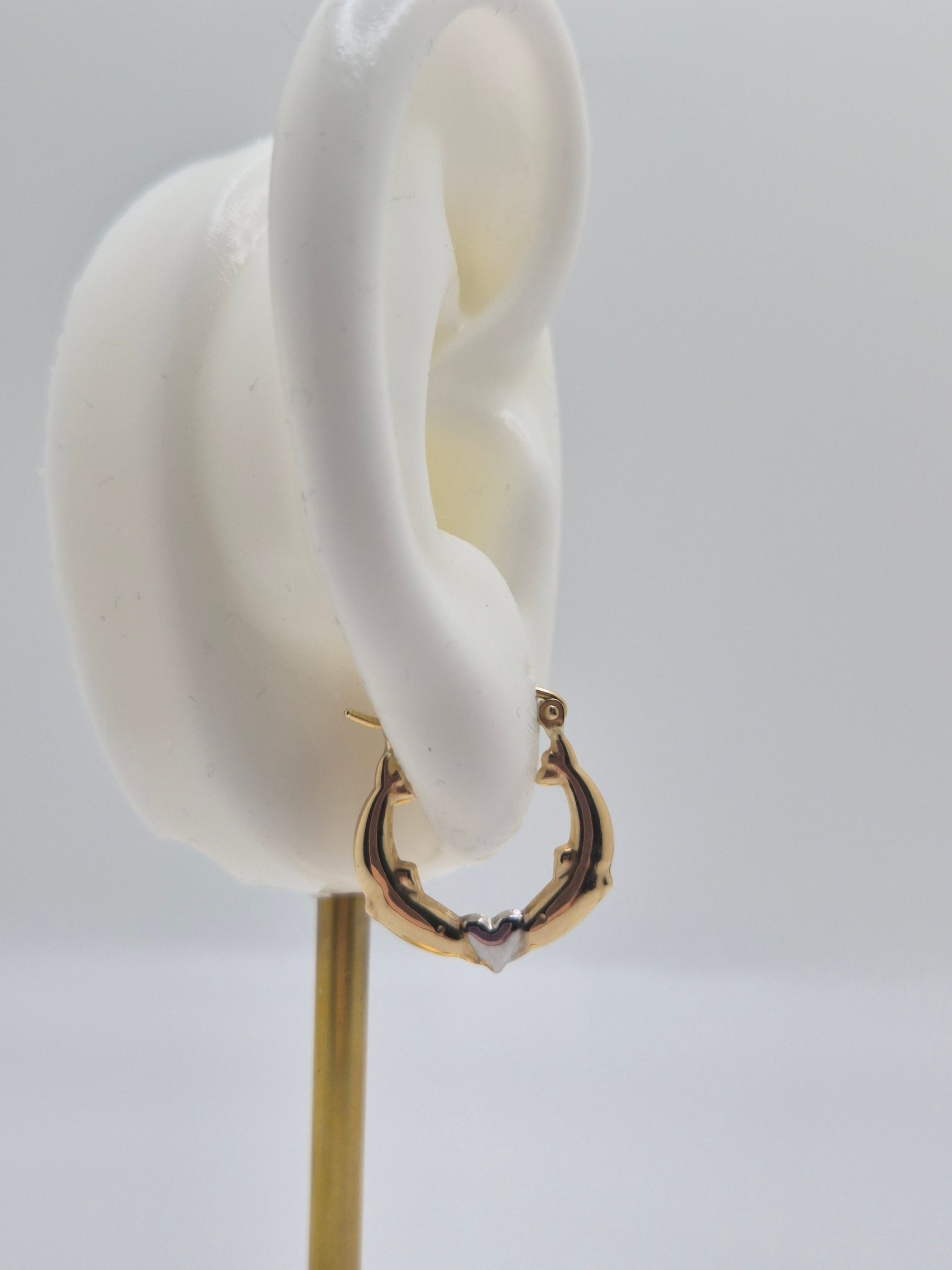 14K two-tone gold dolphin hoop earrings forming a heart design, 17mm lightweight hollow hoops.