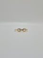 14K yellow gold infinity ring with polished finish, minimal everyday stacking band symbolizing eternal love.