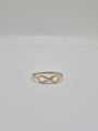 14K yellow gold infinity ring with polished finish, minimal everyday stacking band symbolizing eternal love.