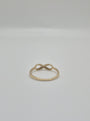 14K yellow gold infinity ring with polished finish, minimal everyday stacking band symbolizing eternal love.