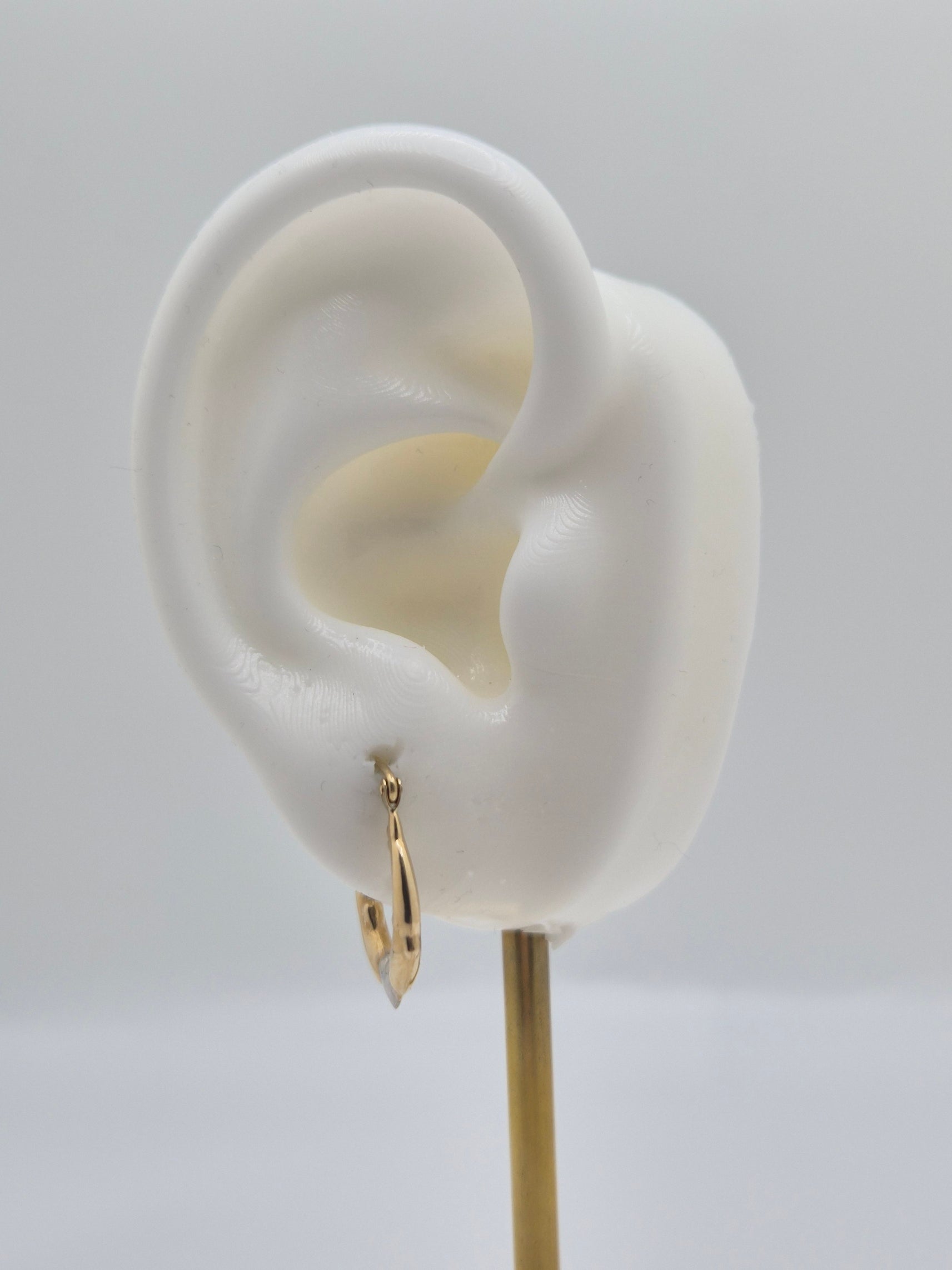 14K two-tone gold dolphin hoop earrings forming a heart design, 17mm lightweight hollow hoops.