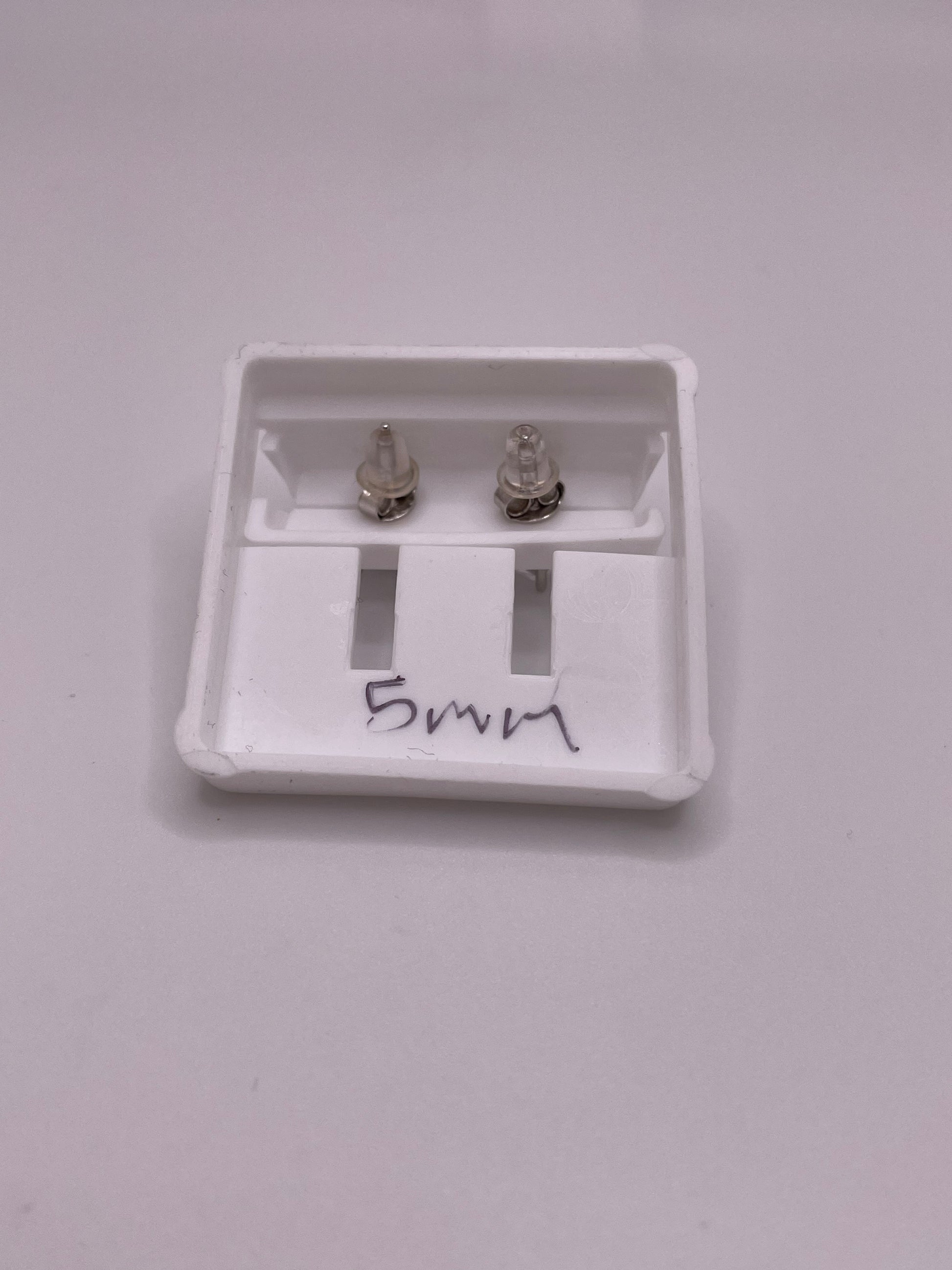 Sterling silver princess-cut CZ stud earrings in 5mm and 6mm, with butterfly backs, sold individually or as a set.