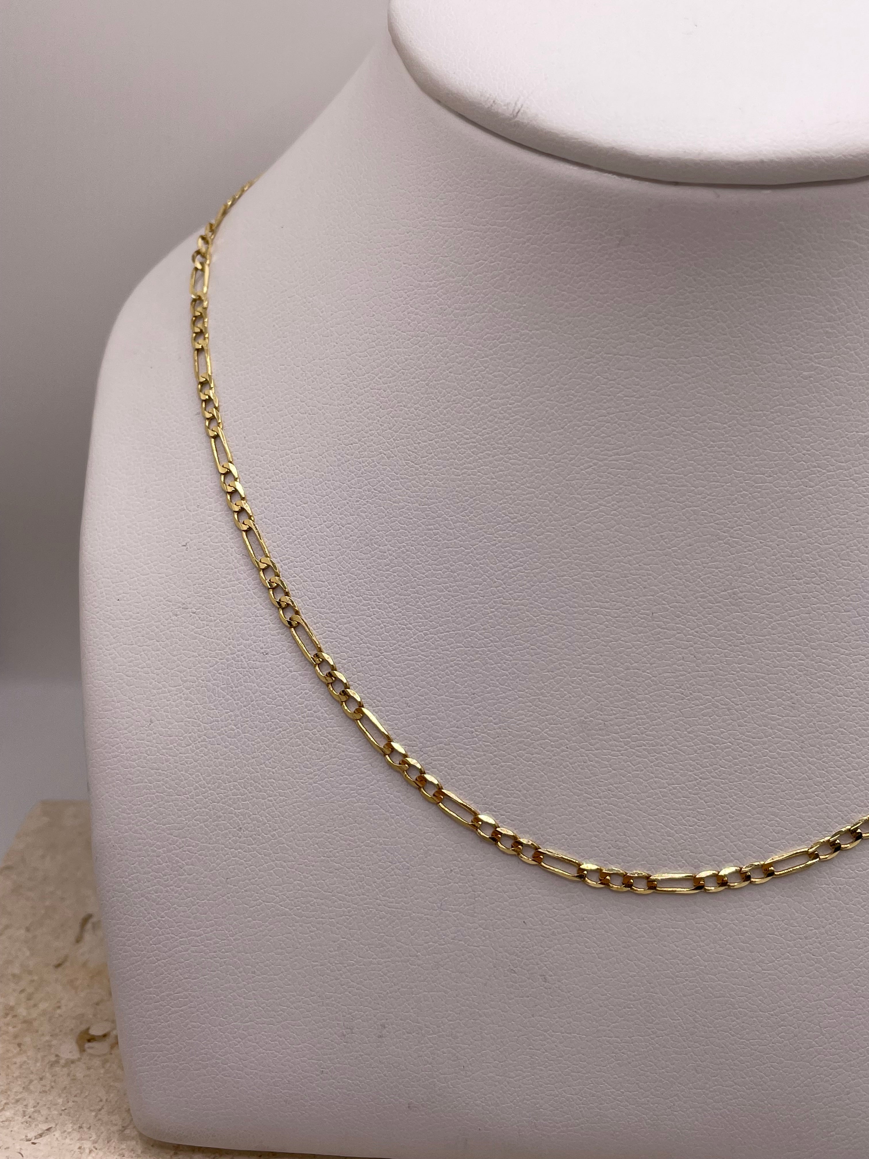 14k gold figaro chain enero