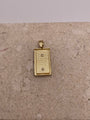 Back view of 14K two-tone gold San Judas pendant showing the smooth finish and craftsmanship