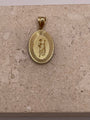Back view of 14K yellow gold oval San Judas pendant showing the polished finish