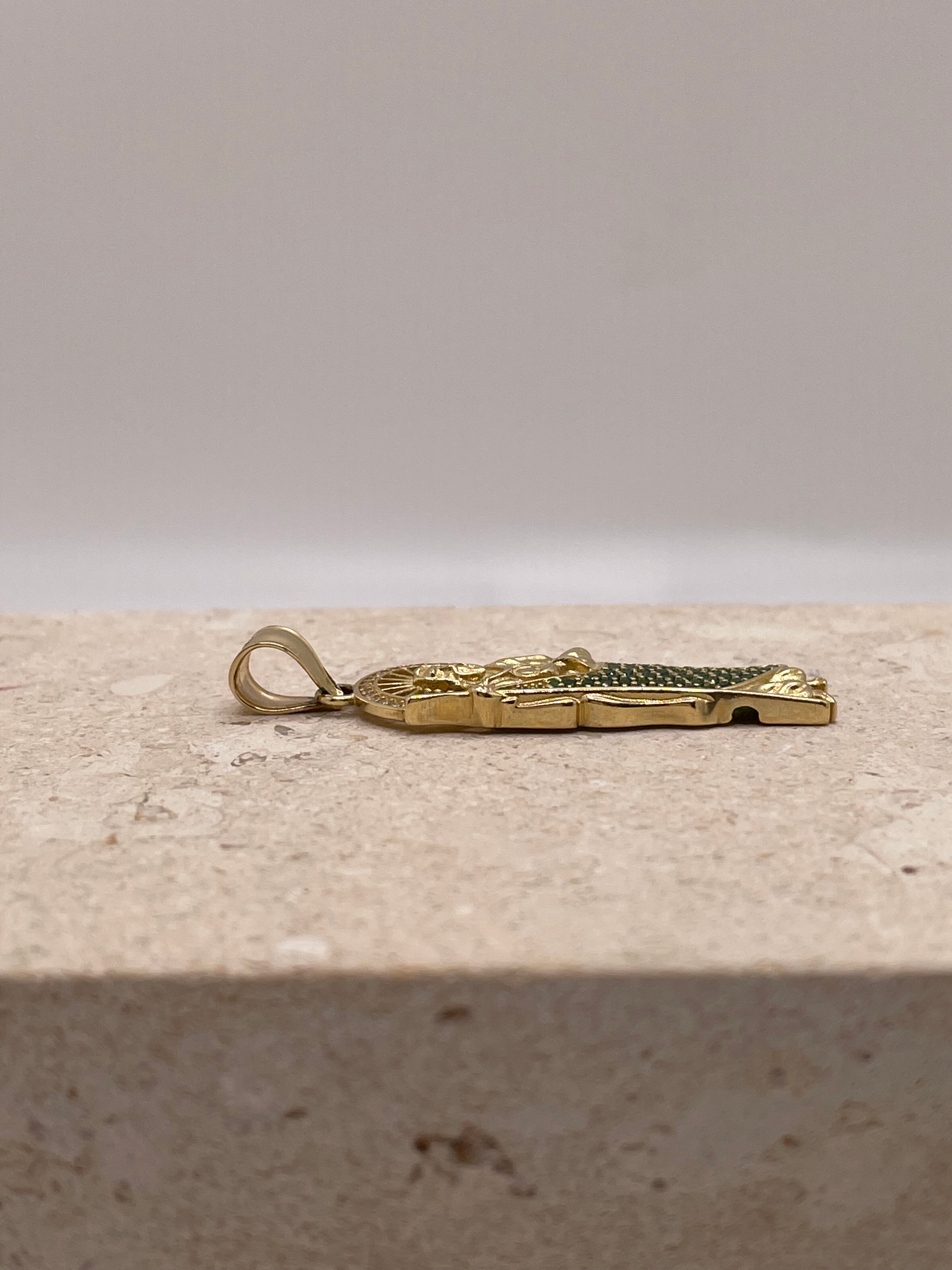 Side view of 14K yellow gold San Judas pendant highlighting the bail design and size