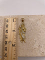 14K yellow gold San Judas pendant with white CZ stones, shown next to a ruler to display dimensions (approximately 1.5 inches)