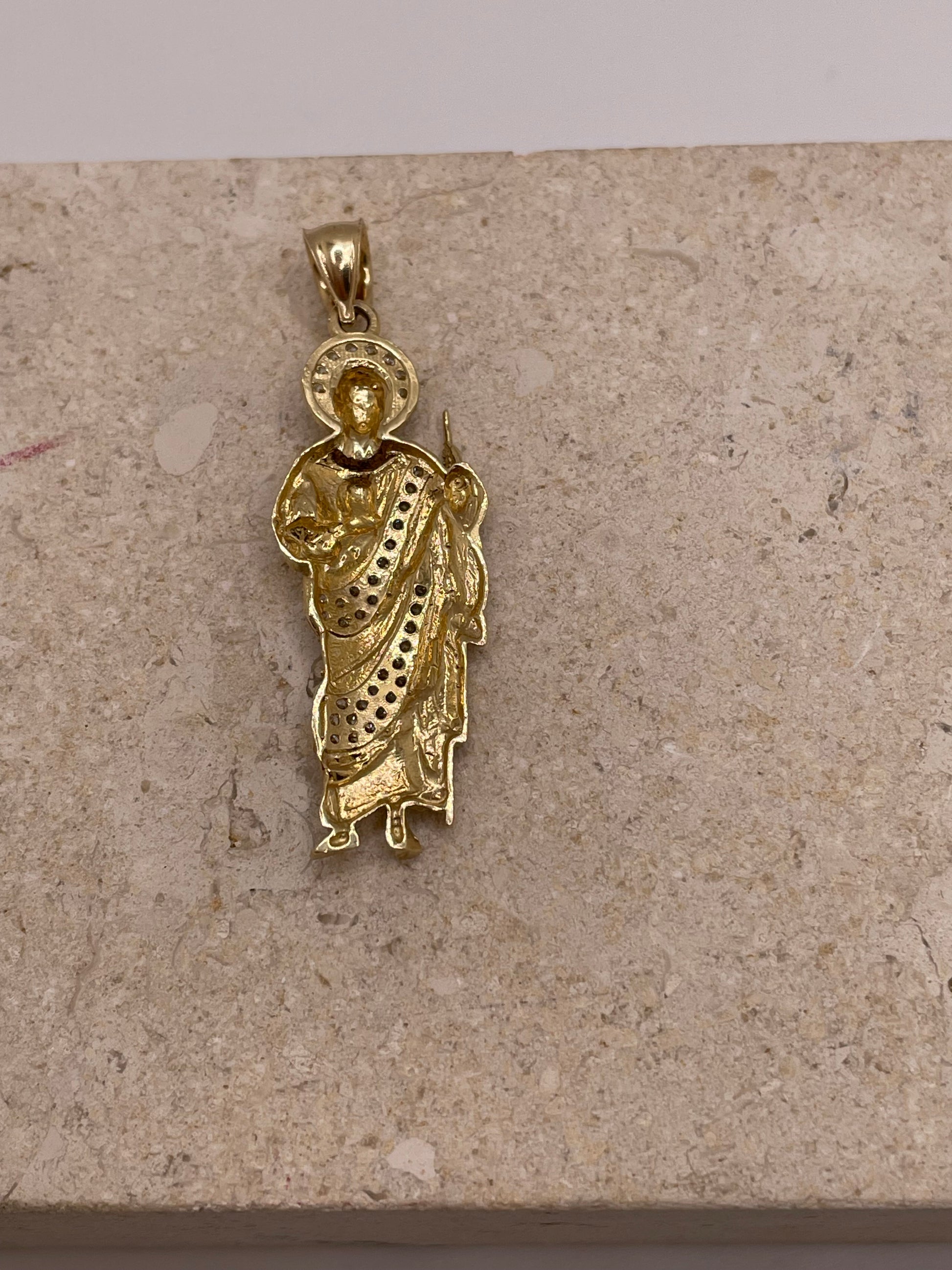 Back view of 14K yellow gold San Judas pendant with smooth polished finish