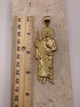 14K yellow gold large San Judas pendant shown next to a ruler to display dimensions (approximately 3.5 inches)