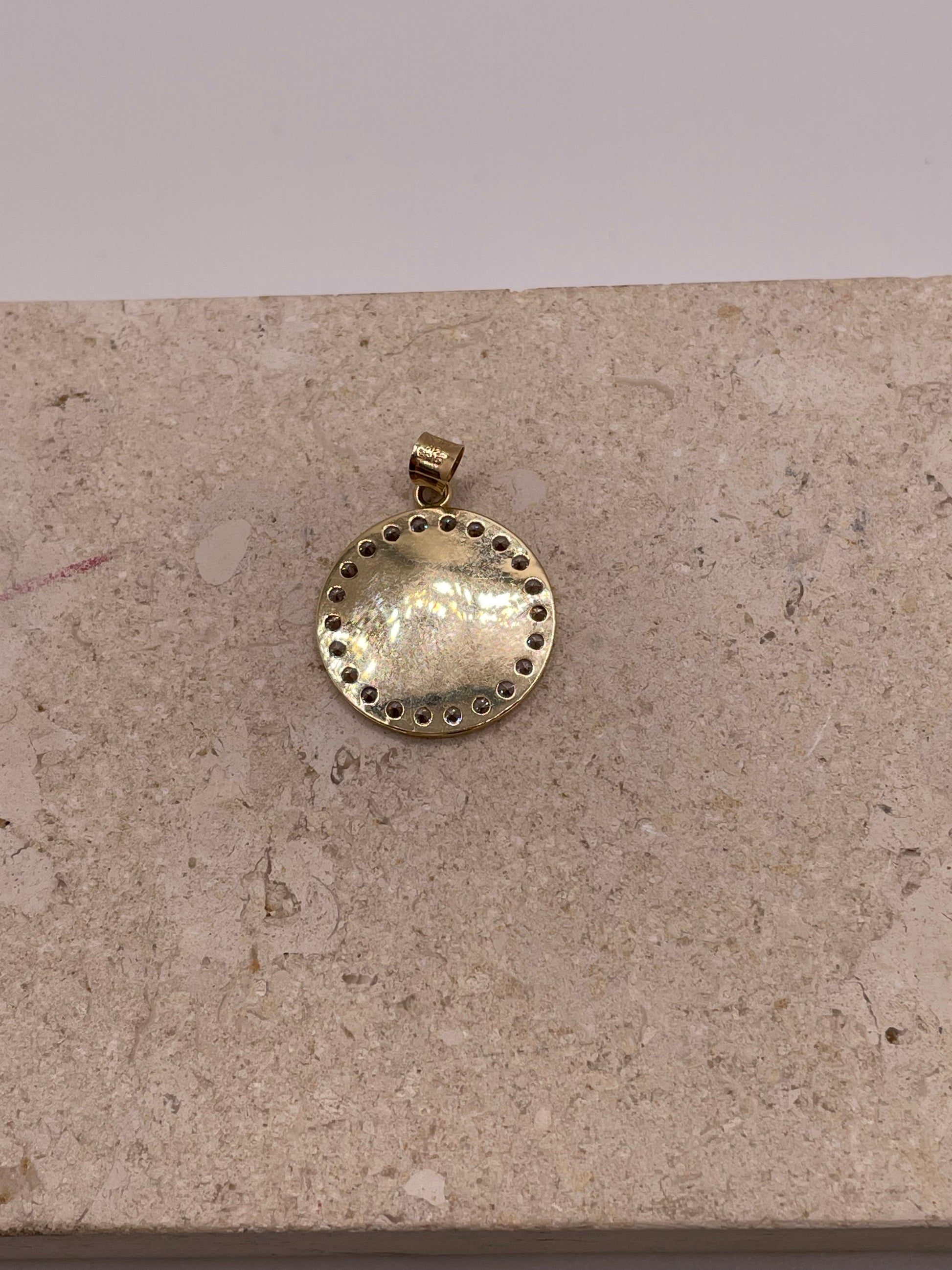 Back view of 14K yellow gold Virgencita pendant with smooth polished finish