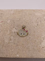 Close-up of 14K gold Hello Kitty pendant with white CZ stones, black CZ eyes and nose, and a pink CZ bow