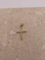 Back view of 14K yellow gold cross pendant with smooth polished finish and visible bail