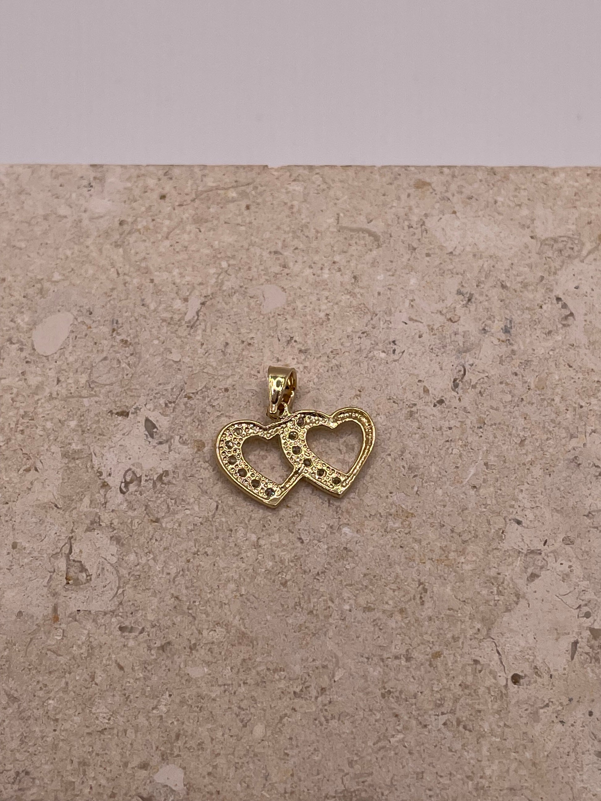 Back view of 14K gold double heart link pendant with smooth polished finish