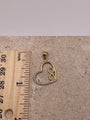 14K gold open heart pendant shown next to a ruler to display dimensions (height: 25mm, width: 16mm)