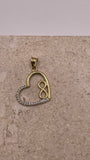 Close-up of 14K gold open heart pendant with small gold infinity symbol and white CZ stones on the left