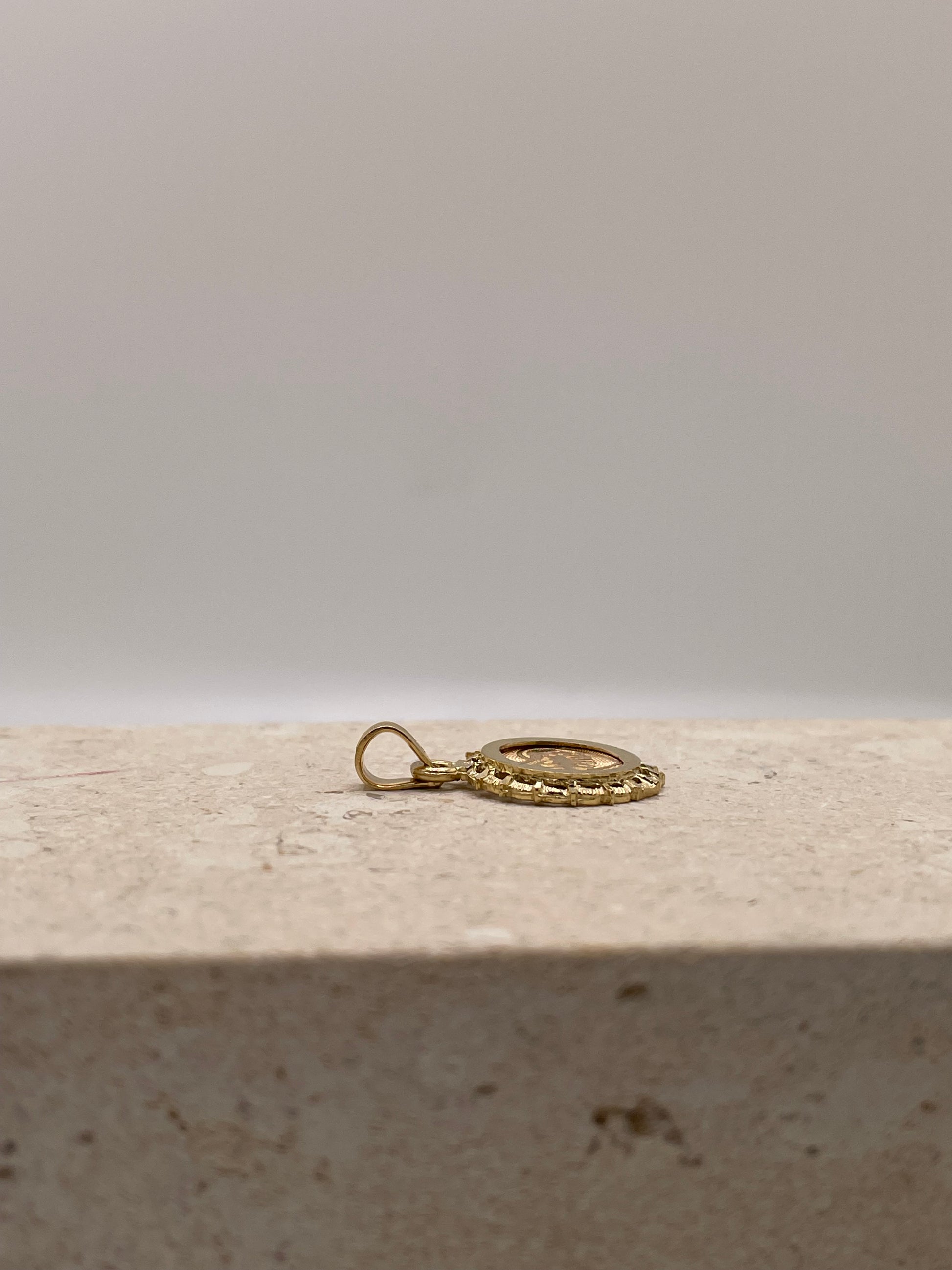 Side view of 14k Gold 'Te Amo' pendant showing fixed bail