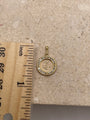 An image showing the pendant next to a ruler, allowing viewers to clearly see the pendant's size of approximately 3/4 inch (19.05 mm) in diameter (with bail). The ruler provides a visual reference for accurate sizing.